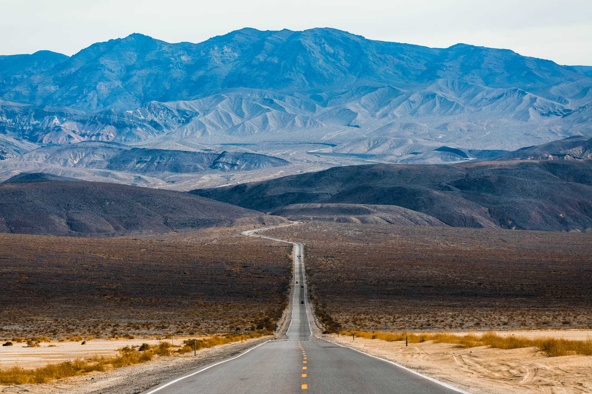 Road in the Death Valley National Park with mountains on the horizon. USA