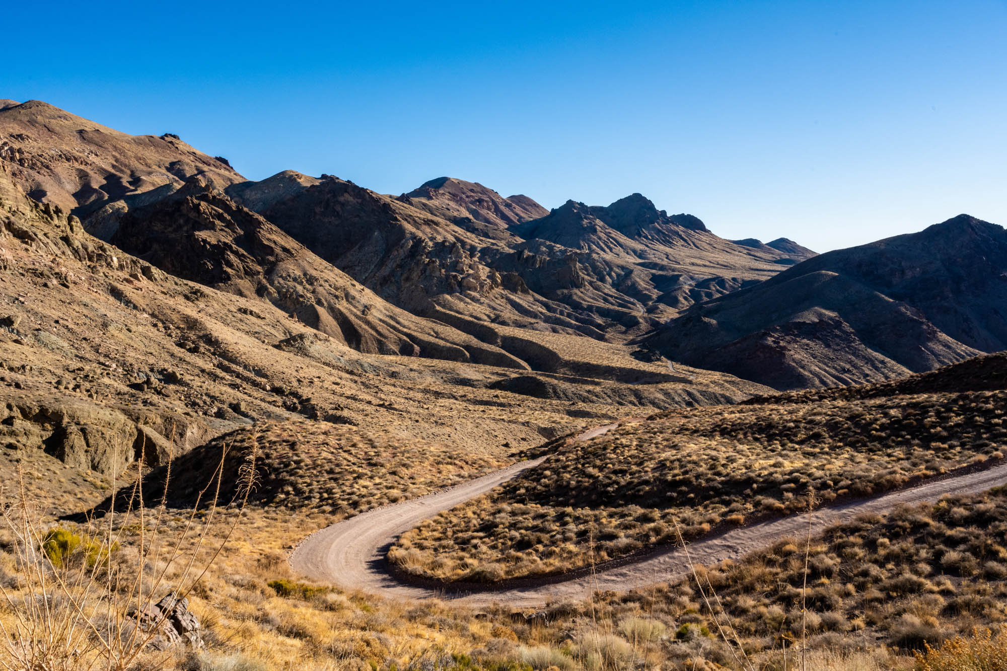 Hairpin Curve Of Titus Canyon Road Climbs The Hillside in Death Valley wilderness